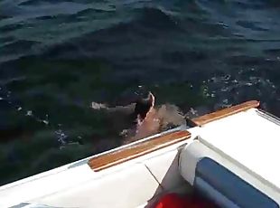 Nudist mature couple having sex on the boat