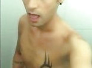 Tattooed twink is pissing in waterpark piss filled toilet