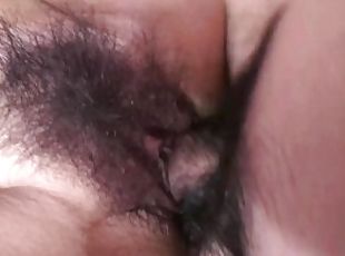 Wet Japanese schoolgirl spread her hairy pussy to get loads of cum inside