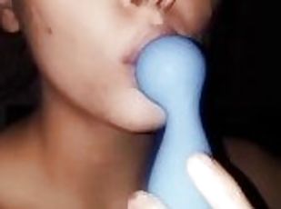 Teen plays with toy in mouth