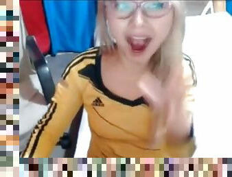Nerdy blonde teen with braces toying