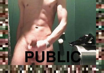 young guy jerking off in a public toilet