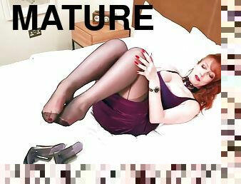 Mature redhead in lingerie masturbating