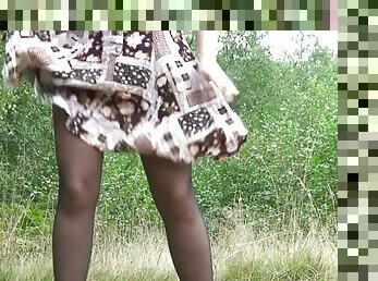 Stockings girl pissing outdoors for relief