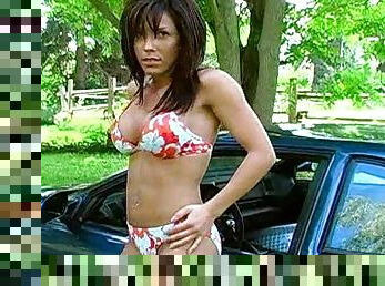 Solo brunette Mya posing outdoors