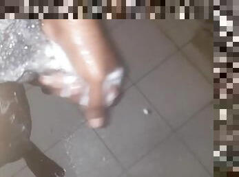 African teen mastrubating in the shower with his big cock