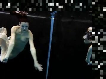 Skinny teens swim in the deep pool naked