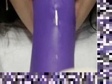 Pretty girl sucking purple cock.