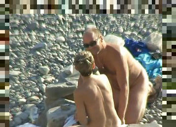 Day at the beach for nude couple