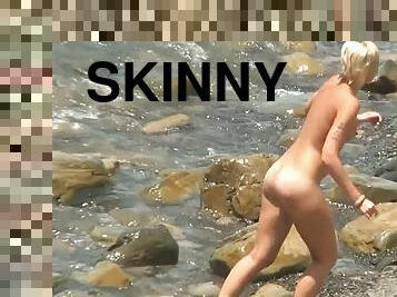Skinny babes are posing on the beach