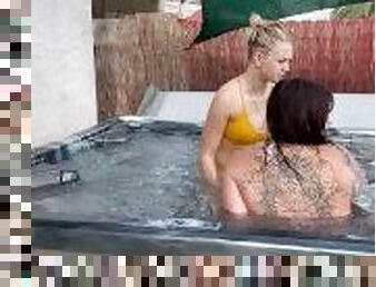 Lesbian couple has a passionate make-out in their new jacuzzi