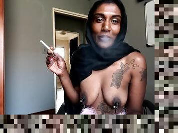 Desi in hijab smoking while wearing nipple clamps
