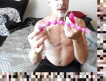 Kinky daddy Richard Lennox uses anal beads on his tight ass