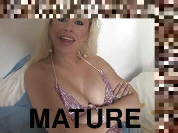 Mature blonde Michelle shows her boobies