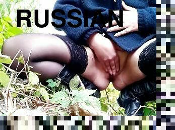 Russian milf in boots and sexy stockings pissing outdoors