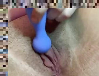 Vibrating my unshaven pussy while my family is in the living room