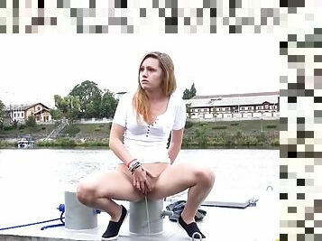 Cute chick by the river taking a hot piss