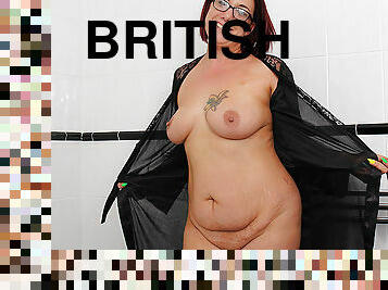 British housewife playing with her shaved pussy in the bathtub