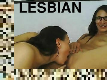 Lesbian brunettes sucking tits and pussy between her