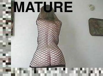 Saggy Boobed GILF Dances in See Trough Fishnet Dress