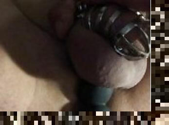 Poor guy is locked in a chastity so he uses a rotating prostate massager for some pleasure