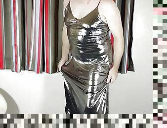 Hot tv in liquid silver shiny sexy dress.