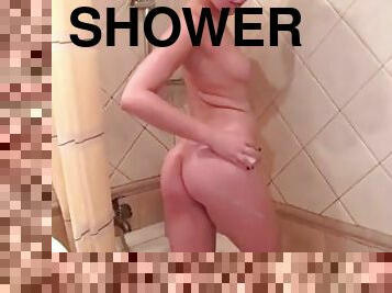 Young Carrie showing tits and pussy in a shower bathroom