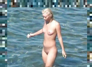 Stunning tanned blonde on the nudist beach