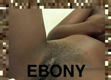 Ebony girl plays with her pussy