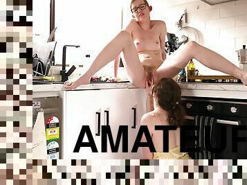 Amateur lesbians Amelia P and Maple licking in the kitchen