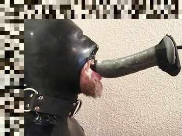 Rubber pig throat fucked by a machine