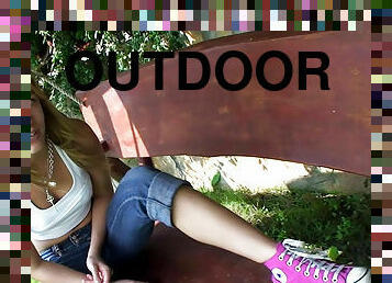 Pretty girl Blue Angel talks outdoors