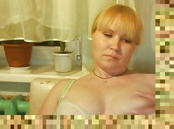 Plump blonde milf Tamara excitingly fondles boobies