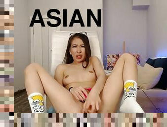 Asian toys her pussy