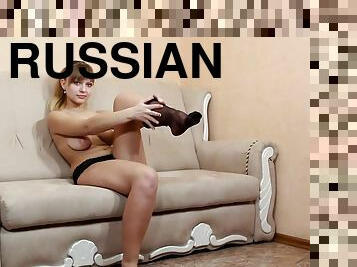 A young Russian porn actress gives her hairy cunt a finger fuck