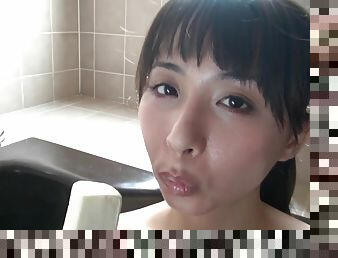 wet young Japanese Asian girl masturbates with icecream in bathtub