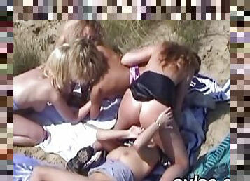 Lesbian teens and stepmoms on the beach
