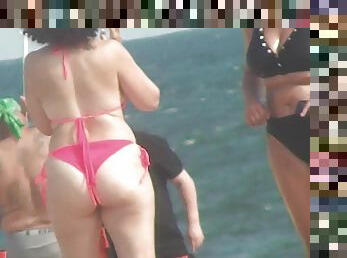 Sexy MILFs with big butts on the beach