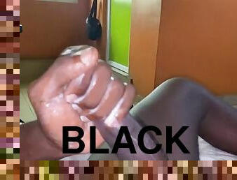 Nigerian black stud stroking his big black cock