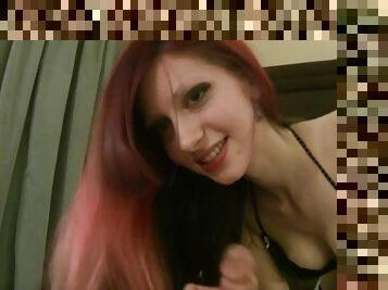 Slender redhead gives a sensual handjob