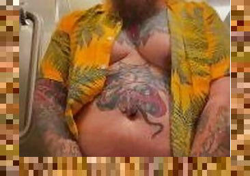 Bearded Tattooed Daddy jerks off in public restroom