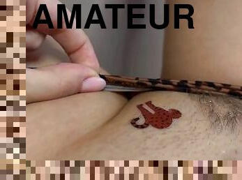 Tattoo master in leopard panty doing temporary tattoo