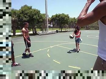 Michelle martinez playing basketball with three black muscle dudes