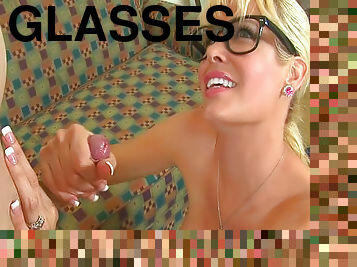 Cute blonde in glasses is giving a hot footjob