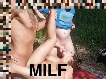 Fuck a milf for two on the beach