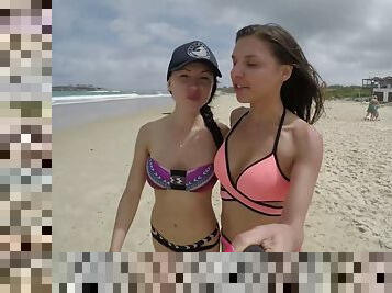 Cute lesbian girls have fun on the beach