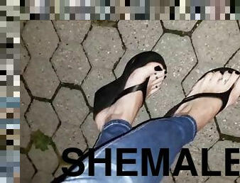 Sexy shemale shows off her amazing feet in platform flip flops on a night walk