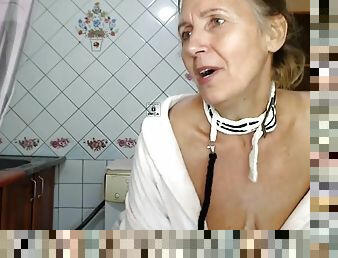 Hot mistress Lukerya in the kitchen in a bathrobe