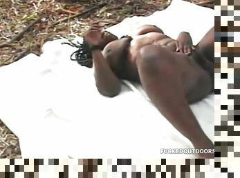 Black girl fucks and sucks cock on blanket outdoors