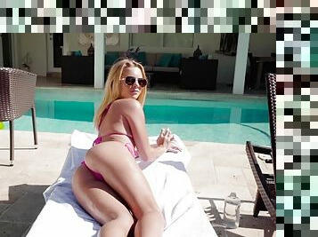 Flat chested blonde rides a cock by the pool